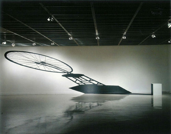 Art installation by Regina Silveira with image of projected shadow of a readymade by Marcel Duchamp