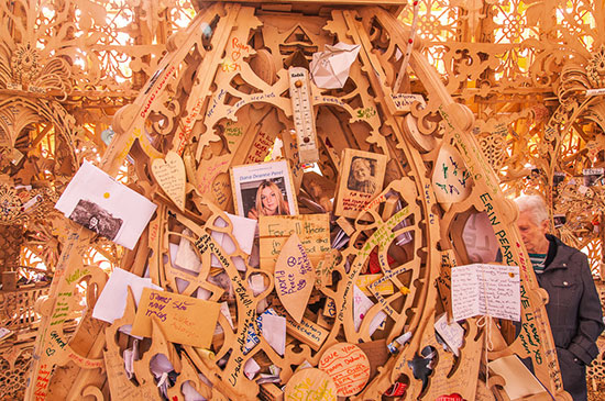 mementos and written prayers and memories left at one of artist David Best's temples