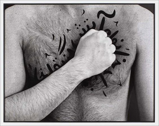 Shirin Neshat photograph of man with fist on chest