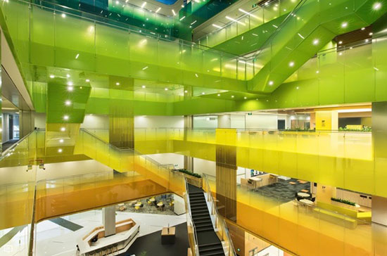 architectural interior with green and yellow walkways and stairways